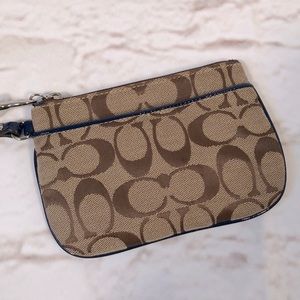 Coach signature C brown tan wristlet pouch bag with strap Zip closure Lined